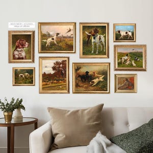 May include: A collection of nine framed paintings depicting hunting dogs and scenes from the countryside. The paintings are in gold frames and feature various breeds of dogs, including pointers, setters, and retrievers. The paintings are arranged in a grid pattern on a white wall.
