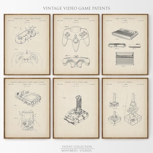 Set of 12 vintage video game blueprint prints featuring game controllers, handheld consoles, cartridges, and TV gaming systems. Ideal for gamer wall art, man cave gaming setups, retro gaming prints, and Father's Day gamer gifts. Blueprint-style decor perfect for classic game room decoration and nostalgic tech lovers.