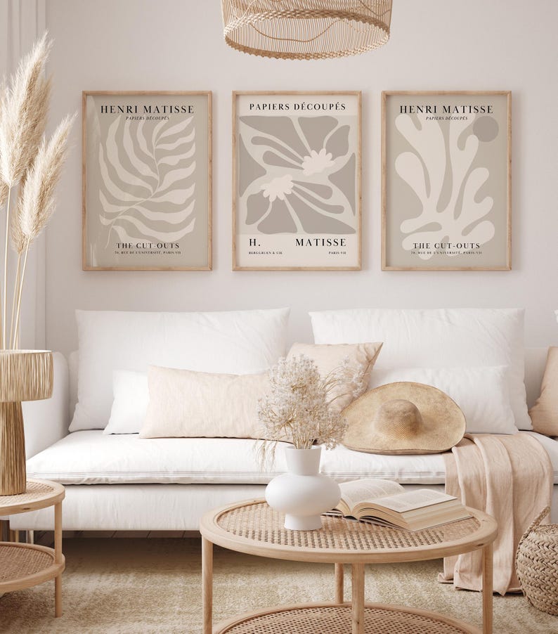 Set of 12 beige Henri Matisse inspired posters featuring abstract botanical shapes, geometric floral forms, and modern cut-out style designs. This neutral boho art collection uses soft beige tones and minimalist lines, making it ideal for a modern gallery wall, or mid-century modern home decor. Elegant abstract flowers and geometric modern art prints create a cohesive, calm aesthetic for living rooms, bedrooms, and stylish interiors.