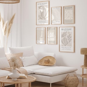 Set of 12 beige Henri Matisse inspired posters featuring abstract botanical shapes, geometric floral forms, and modern cut-out style designs. This neutral boho art collection uses soft beige tones and minimalist lines, making it ideal for a modern gallery wall, or mid-century modern home decor. Elegant abstract flowers and geometric modern art prints create a cohesive, calm aesthetic for living rooms, bedrooms, and stylish interiors.