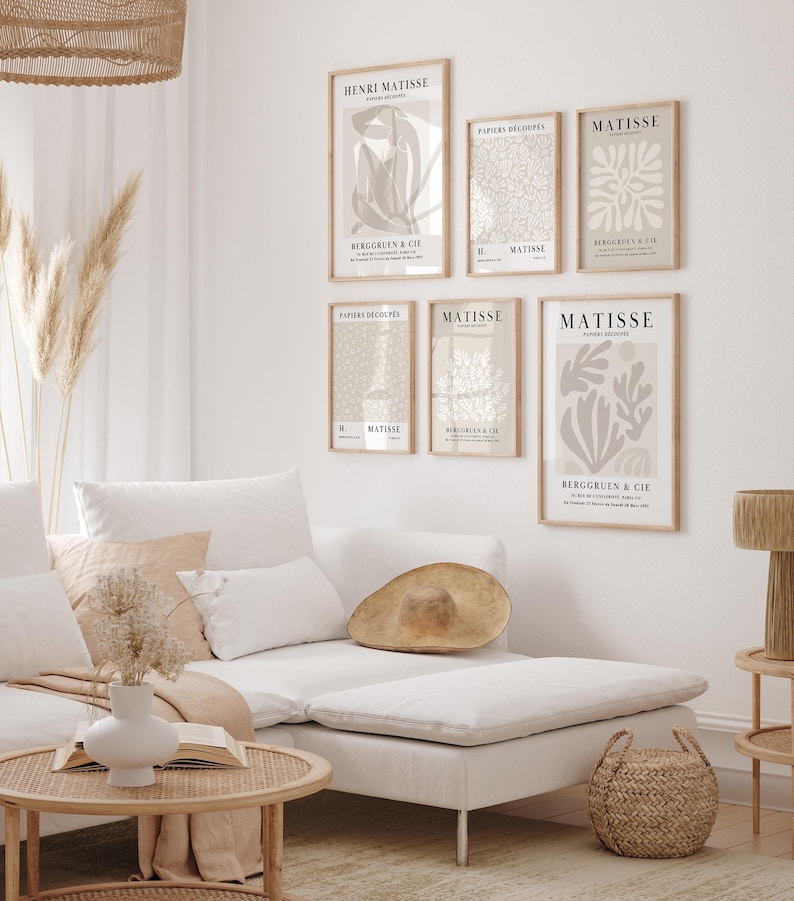 Set of 12 beige Henri Matisse inspired posters featuring abstract botanical shapes, geometric floral forms, and modern cut-out style designs. This neutral boho art collection uses soft beige tones and minimalist lines, making it ideal for a modern gallery wall, or mid-century modern home decor. Elegant abstract flowers and geometric modern art prints create a cohesive, calm aesthetic for living rooms, bedrooms, and stylish interiors.