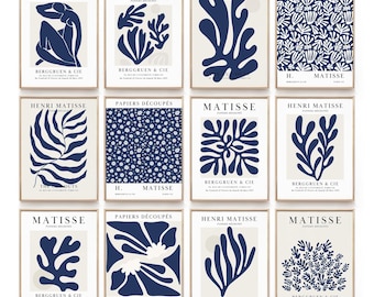 Puede incluir: Un conjunto de 12 láminas de arte mural digital con diseños Papiers Découpés de Henri Matisse. Cada lámina muestra formas orgánicas, patrones florales o figuras abstractas en azul oscuro sobre un fondo crema, con texto como Matisse y Berggruen & Cie.