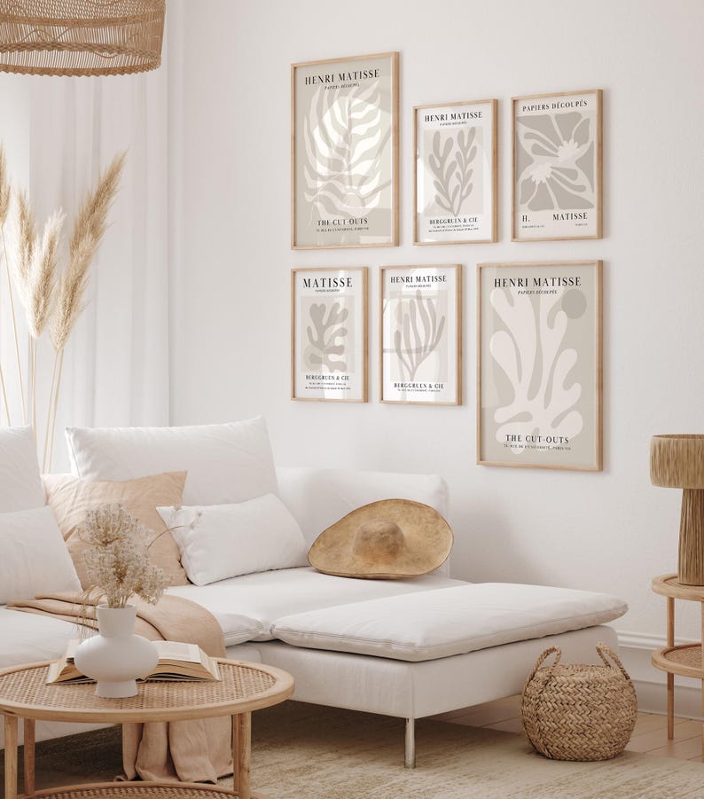 Set of 12 beige Henri Matisse inspired posters featuring abstract botanical shapes, geometric floral forms, and modern cut-out style designs. This neutral boho art collection uses soft beige tones and minimalist lines, making it ideal for a modern gallery wall, or mid-century modern home decor. Elegant abstract flowers and geometric modern art prints create a cohesive, calm aesthetic for living rooms, bedrooms, and stylish interiors.