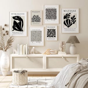 Set of 12 Henri Matisse inspired printable posters in striking black and beige tones, featuring minimalist abstract forms, geometric modern art, and subtle abstract flowers. This mid century modern Matisse gallery wall set combines bold black shapes with warm beige backgrounds for a refined, timeless look. Ideal for minimalist black art lovers, neutral boho interiors, and modern spaces, these coordinated prints bring balance and artistic character to living rooms, bedrooms, offices, or entryways