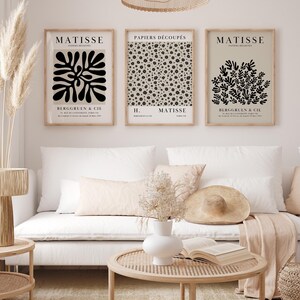 Set of 12 Henri Matisse inspired printable posters in striking black and beige tones, featuring minimalist abstract forms, geometric modern art, and subtle abstract flowers. This mid century modern Matisse gallery wall set combines bold black shapes with warm beige backgrounds for a refined, timeless look. Ideal for minimalist black art lovers, neutral boho interiors, and modern spaces, these coordinated prints bring balance and artistic character to living rooms, bedrooms, offices, or entryways