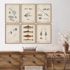 Set of 12 Vintage Fishing Patent Prints, featuring Trout and Bass fishing art. Includes Male Brook Trout, Lake Trout, Rocky Mountain Trout, Largemouth, Smallmouth, and Striped Bass. Showcasing vintage fishing patents with detailed illustrations of fishing gear, tackle, lures, reels, and a tackle box. Ideal for fishing enthusiasts, anglers, and man cave decor. Perfect for lake house walls or as a unique fishing gift. Classic, freshwater fishing and North American game fish.