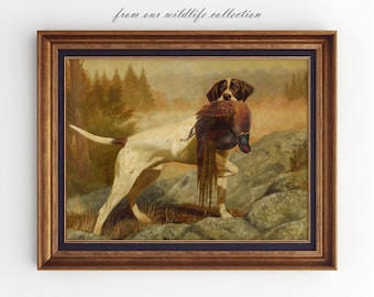 May include: A vintage oil painting of a white and brown hunting dog with a pheasant in its mouth. The dog is standing on a rocky terrain with a forest background. The painting is framed in a brown and gold frame.