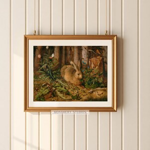 Vintage rabbit art print featuring a bunny in a forest scene, perfect for spring and Easter decor. Antique wildlife artwork with rustic nature charm, ideal for forest animal decor, nature-inspired wall art, and vintage bunny prints for home and cabin