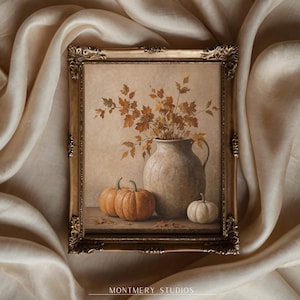 Muted pumpkin still life printable wall art, featuring orange pumpkins, a white pumpkin, rustic ceramic vase, and dried autumn leaves on a wooden table. Warm neutral fall painting for farmhouse decor, Thanksgiving wall art, fall kitchen print, mantel styling, rustic autumn decor, and cozy seasonal home decor.