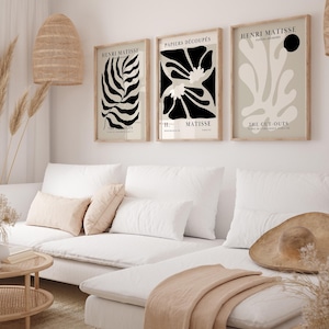Set of 12 Henri Matisse inspired printable posters in striking black and beige tones, featuring minimalist abstract forms, geometric modern art, and subtle abstract flowers. This mid century modern Matisse gallery wall set combines bold black shapes with warm beige backgrounds for a refined, timeless look. Ideal for minimalist black art lovers, neutral boho interiors, and modern spaces, these coordinated prints bring balance and artistic character to living rooms, bedrooms, offices, or entryways