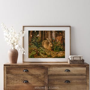 Vintage rabbit art print featuring a bunny in a forest scene, perfect for spring and Easter decor. Antique wildlife artwork with rustic nature charm, ideal for forest animal decor, nature-inspired wall art, and vintage bunny prints for home and cabin