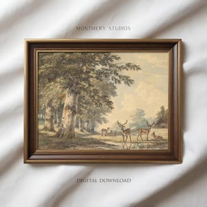 May include: Framed vintage landscape art print featuring a forest scene with deer near a body of water. The artwork has a brown frame and the text "MONTMMERY STUDIOS" and "DIGITAL DOWNLOAD". The print has a classic, antique aesthetic.