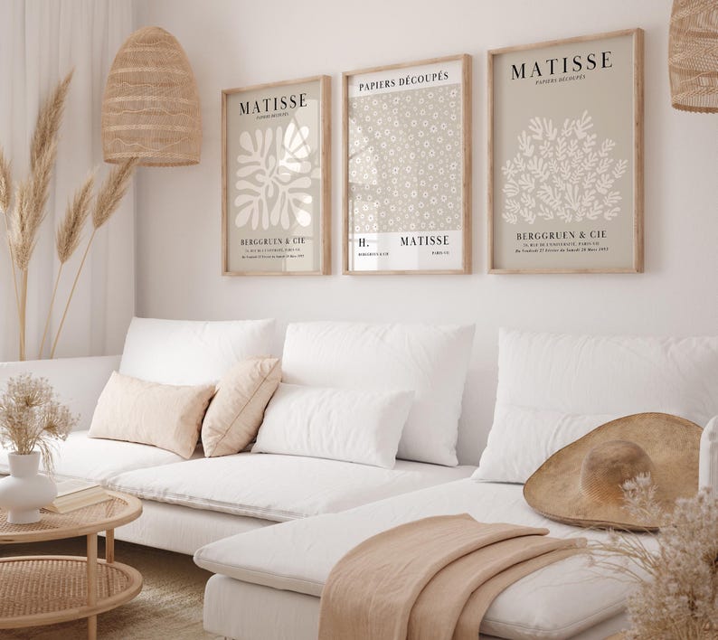 Set of 12 beige Henri Matisse inspired posters featuring abstract botanical shapes, geometric floral forms, and modern cut-out style designs. This neutral boho art collection uses soft beige tones and minimalist lines, making it ideal for a modern gallery wall, or mid-century modern home decor. Elegant abstract flowers and geometric modern art prints create a cohesive, calm aesthetic for living rooms, bedrooms, and stylish interiors.