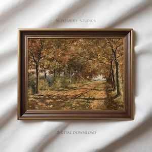 Puede incluir: Una pintura de paisaje enmarcada representa un camino a través de un bosque en otoño. La obra presenta un camino de tierra bordeado de árboles con hojas naranjas y marrones. El marco es de color marrón oscuro y cálido. El texto "MONTMERY STUDIOS" y "DIGITAL DOWNLOAD" son visibles.