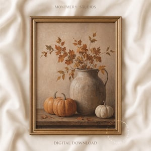 May include: A framed wall art print titled MONTMERY STUDIOS DIGITAL DOWNLOAD featuring a rustic ceramic pitcher filled with autumn maple branches, two orange pumpkins, and one small white pumpkin resting on a wooden surface.