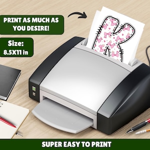 May include: A printer is shown with a printed sheet featuring a letter "K" decorated with pink bows. The text "PRINT AS MUCH AS YOU DESIRE!" and "SUPER EASY TO PRINT" are displayed. The paper size is 8.5x11 inches.