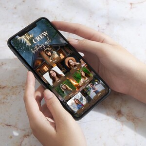 Peut inclure: Un smartphone affiche un graphique personnalis&eacute; avec le texte "The Crew birthday girl". Le graphique pr&eacute;sente une sc&egrave;ne de chalet et des photos individuelles. Le t&eacute;l&eacute;phone est tenu &agrave; deux mains.