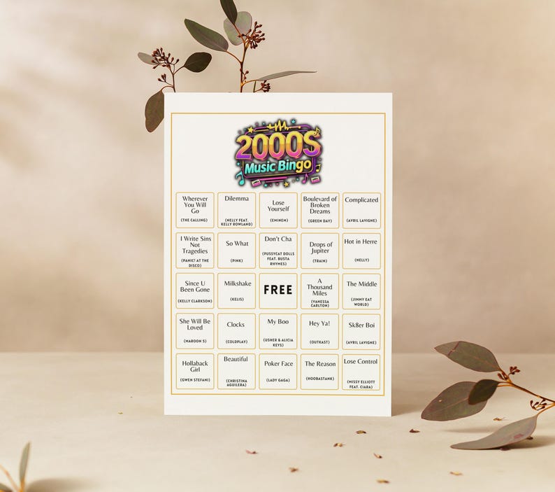 May include: A 2000s Music Bingo card with a colorful logo at the top. The bingo card features song titles like "Milkshake" and "Hey Ya!" against a cream background. The word "FREE" is in the center.