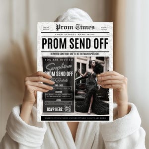 May include: A person holding a newspaper-style invitation for a prom send-off. The invitation is black and white and features the headline "PROM SEND OFF". Details include the date, time, location, and dress code. The invitation also features a photo of a person in a formal black dress.