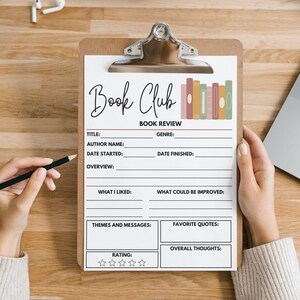 May include: A clipboard with a "Book Club" book review form. The form includes sections for title, author, genre, and more. A hand holds a pencil, ready to write. The form has a decorative row of books.