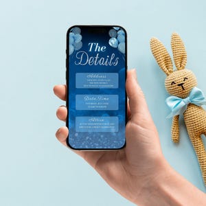 May include: A blue and silver smartphone screen displaying a baby shower invitation with the text "The Details" and sections for address, date, time, and attire.
