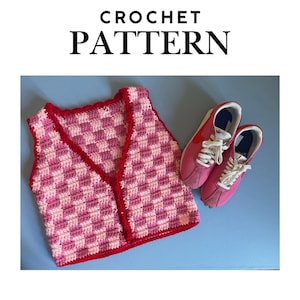 May include: A crochet vest with a pink and white checkerboard pattern and red trim. The vest is paired with pink sneakers with white laces. The words "CROCHET PATTERN" are at the top of the image.
