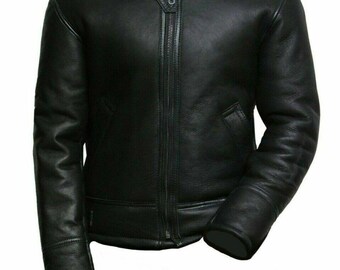 May include: A black leather jacket with a black fur collar. The jacket has a zipper closure and two pockets. The sleeves are long and end with a cuff. The jacket is a classic style.