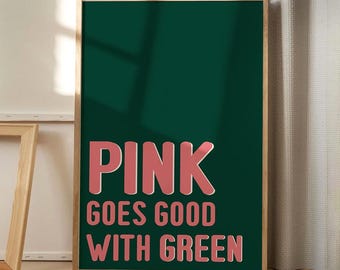 May include: A framed print with a green background and pink text that reads "PINK goes good with GREEN".