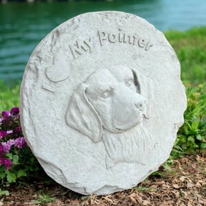 May include: A round, light gray stone garden stepping stone with the words "My Pointer" and a heart carved into the surface. The stone features a detailed relief of a dog's head.