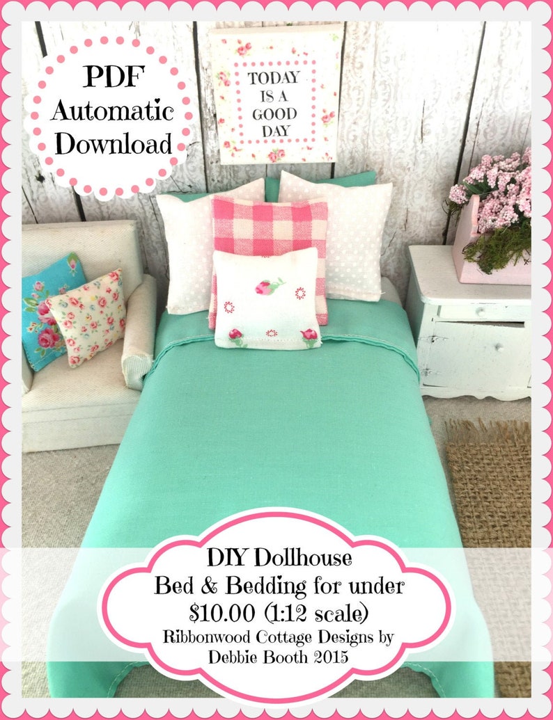 May include: A DIY dollhouse bed and bedding set in a 1:12 scale. The bed is turquoise with a white headboard and footboard. The bedding is white with pink and white gingham pillows and a white pillow with a floral design. The bed is sitting on a white rug. The text "TODAY IS A GOOD DAY" is on a sign above the bed. The text "DIY Dollhouse Bed & Bedding for under $10.00 (1:12 scale) Ribbonwood Cottage Designs by Debbie Booth 2015" is on a white cloud-shaped background.