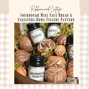 May include: A wooden bowl filled with faux bread and miniature jars labelled "Flour", "Yeast", and "Sourdough Starter". The bread pieces are various shades of brown and tan, some with decorative patterns. The text "Ribbonwood Cottage" and "SOURDOUGH MINI FAUX BREAD & CANISTERS BOWL FILLERS PATTERN" are also visible.