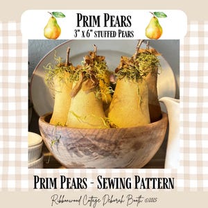 May include: A wooden bowl contains several stuffed pears, each approximately 7.6 cm wide and 15.2 cm tall. The pears are a light yellow colour, with brown stems and green moss accents. The text "PRIM PEARS" and "STUFFED PEARS" is displayed above the pears.