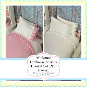 May include: A PDF pattern for a miniature dollhouse sheet and blanket set with a white background and pink trim. The pattern is by Ribbonwood Cottage Designs by Debbie Booth 2016.