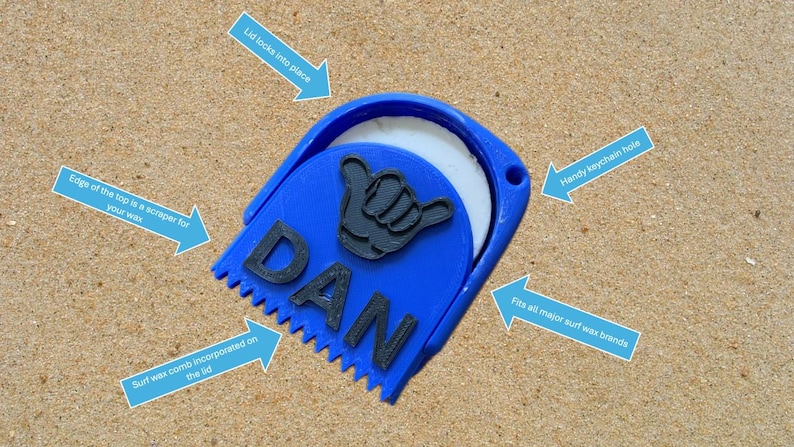 May include: Blue surf wax container with a comb and a scraper. The lid locks into place and has a keychain hole. The container is labeled "DAN".