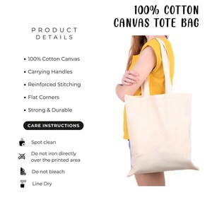 a person holding a white canvas tote bag.