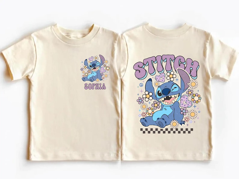 two white t-shirts with a cartoon character design and text printed on them.