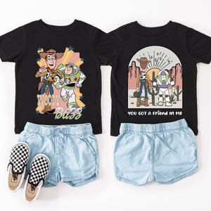 a pair of shorts and a t - shirt with cartoon characters on them