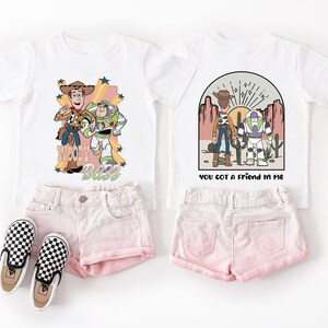 a pair of shorts and a t - shirt with a picture of a cartoon character