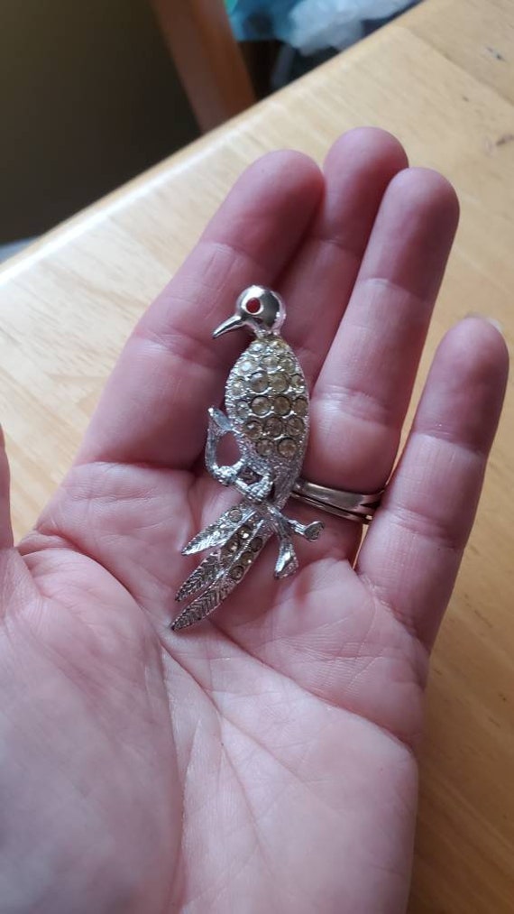 Bird on a branch brooch, silvertone, rhinestones, 