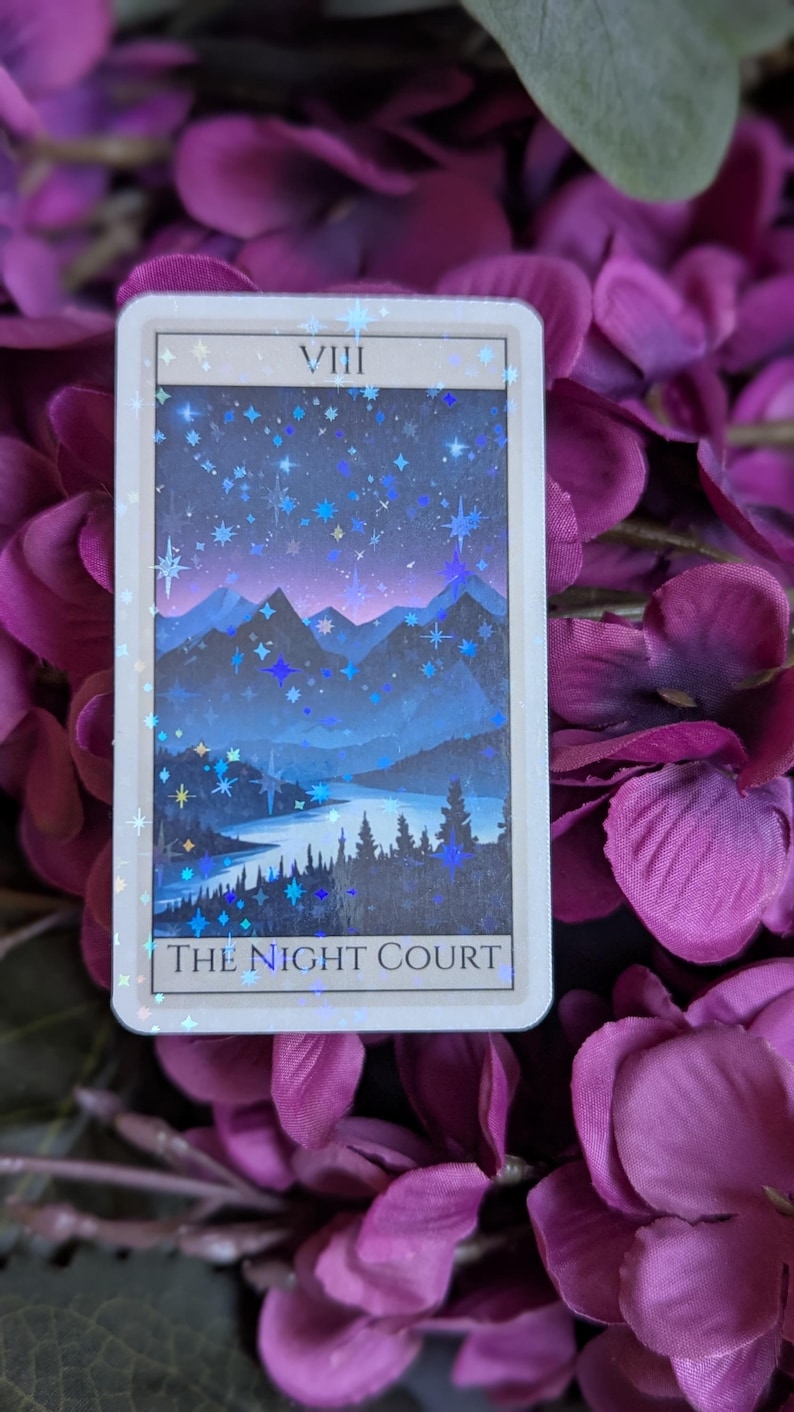 May include: A tarot card with a blue and purple mountain landscape under a starry night sky. The card is labeled "VIII THE NIGHT COURT".