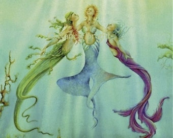 Sisters Of The Sea - Three mermaids bask underwater in the rays of the sun