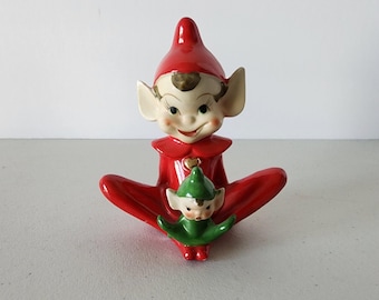 1950s Red Sitting Christmas Elf With Little Green Elf On Foot Figurine