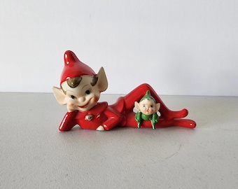 1950s Red Reclining Christmas Elf With Little Green Elf On Leg Figurine