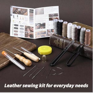 May include: A leather sewing kit containing needles, spools of thread, scissors, and a thimble. A yellow tape measure and instruction booklet are also included. The text "Leather sewing kit for everyday needs" is displayed.