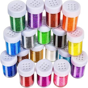 May include: A collection of small, clear plastic jars filled with colorful glitter. The glitter colors include green, purple, orange, blue, silver, gold, and pink. Each jar has a white lid with small holes.