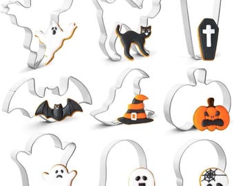 May include: A set of nine silver-toned metal cookie cutters in various Halloween shapes, including a ghost, cat, coffin, bat, witch hat, pumpkin, and skull, each paired with a corresponding decorated cookie featuring icing in black, white, and orange.