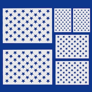 May include: A collection of white stencils featuring a blue star pattern, arranged in the shape of the American flag. The stencils are of varying sizes and shapes, set against a deep blue background.