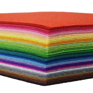 May include: A stack of colorful felt sheets in various shades, including red, pink, yellow, green, blue, and brown. The felt appears to be neatly stacked, showcasing a spectrum of colors. This image is suitable for craft projects.