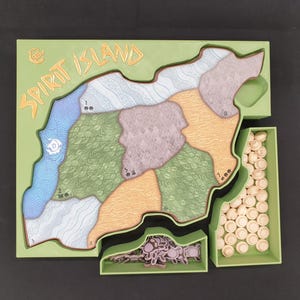 May include: A board game titled "Spirit Island" with a green frame. The game board features a map divided into numbered regions with various colors and textures. Includes small, beige game pieces and tokens in green trays.