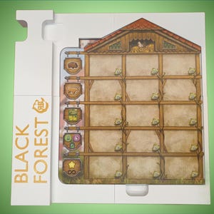 May include: A white wooden game board with a brown and beige illustration of a house with a roof and windows. The board has a vertical section on the left side with the text "BLACK FOREST" in gold lettering. The board has a series of squares with small illustrations of animals and crops.